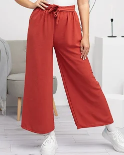 Spodnie Materiałowe^Royalfashion Damskie szerokie spodnie palazzo w kolorze m- Odzież czerwony