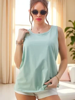 Bluzki / Koszule / Koszulki^Royalfashion Bawełniana bluzka bokserka damska na ramiączkach z koronką na plecach jasnozielony