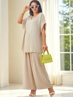 Komplety Damskie^Royalfashion Bawełniany damski komplet z krótkim rękawem i poszerzanymi spodniami Jasny beż