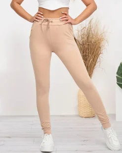 Spodnie Dresowe^Royalfashion Beżowe damskie spodnie dresowe z cyrkoniami beżowy