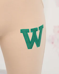 Spodnie Dresowe^Royalfashion Beżowe damskie spodnie dresowe z kolorową naszywką beżowy