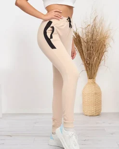 Spodnie Dresowe^Royalfashion Beżowe damskie spodnie dresowe z czarnymi wstawkami beżowy