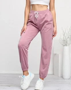 Spodnie Dresowe^Royalfashion Ciemnoróżowe damskie spodnie dresowe typu joggery ciemnoróżowy