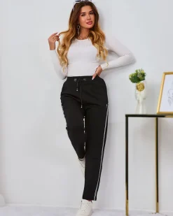 Spodnie Dresowe^Royalfashion Czarne damskie spodnie dresowe z lampasami