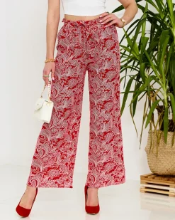 Spodnie Materiałowe^Royalfashion Czerwone damskie spodnie materiałowe z printem czerwony