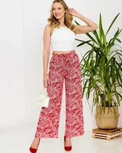 Spodnie Materiałowe^Royalfashion Czerwone damskie spodnie materiałowe z printem czerwony