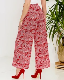 Spodnie Materiałowe^Royalfashion Czerwone damskie spodnie materiałowe z printem czerwony