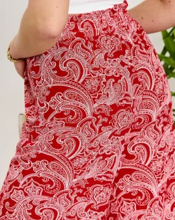 Spodnie Materiałowe^Royalfashion Czerwone damskie spodnie materiałowe z printem czerwony