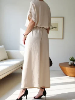 Komplety Damskie^Royalfashion Damski komplet casualowy z bluzką z krótkim rękawem i szerokimi spodniami Jasny beż