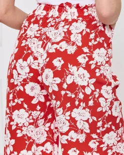 Spodnie Materiałowe^Royalfashion Damskie czerwone kwiatowe spodnie typu palazzo czerwony