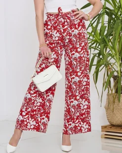 Spodnie Materiałowe^Royalfashion Damskie czerwone spodnie typu palazzo z białymi kwiatami czerwony