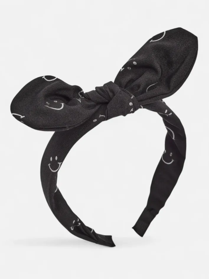 Akcesoria Do Włosów^Royalfashion Dziecięca opaska do włosów z kokardką z printem w uśmiechnięte buźki czarny