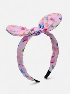 Akcesoria Do Włosów^Royalfashion Dziecięca opaska do włosów z kokardką z printem fioletowy