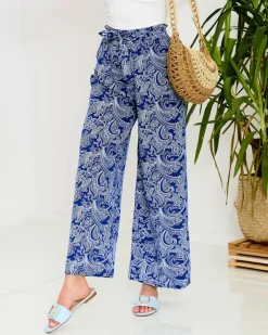 Spodnie Materiałowe^Royalfashion Granatowe damskie spodnie materiałowe z printem Granatowy