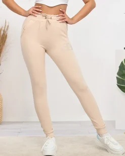 Spodnie Dresowe^Royalfashion Jasnobeżowe damskie spodnie dresowe z cyrkoniami jasny brązowy