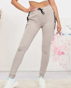 Spodnie Dresowe^Royalfashion Jasnoszare damskie spodnie dresowe z czarnymi wstawkami Jasny szary