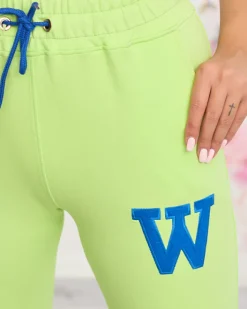 Spodnie Dresowe^Royalfashion Neonowe zielone damskie spodnie dresowe z kolorową naszywką zielony