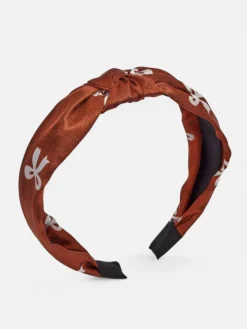 Akcesoria Do Włosów^Royalfashion Opaska do włosów satynowa z pleceniem z nadrukiem brązowy