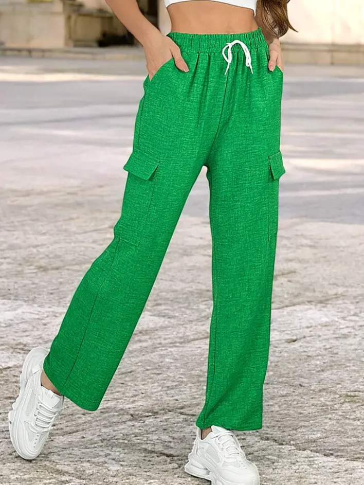 Spodnie Materiałowe^Royalfashion Szerokie spodnie damskie z kieszeniami zielony