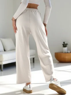 Spodnie Materiałowe|Spodnie Dresowe^Royalfashion Wiskozowe szerokie spodnie damskie dresowe z cyrkoniami biały