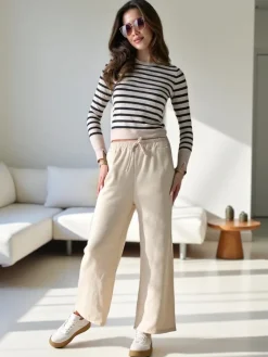 Spodnie Materiałowe|Spodnie Dresowe^Royalfashion Wiskozowe szerokie spodnie damskie dresowe beżowy