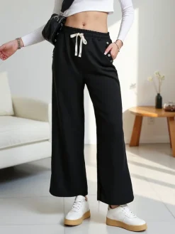 Spodnie Materiałowe|Spodnie Dresowe^Royalfashion Wiskozowe szerokie spodnie damskie dresowe z cyrkoniami czarny