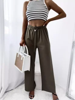 Spodnie Materiałowe^Royalfashion Zielone damskie szerokie spodnie prążkowane zielony